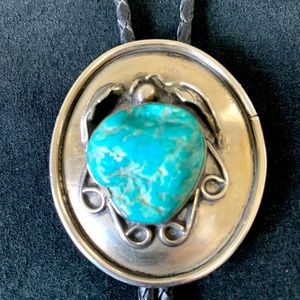 Silver and turquoise Squash Blossom bolo tie.
